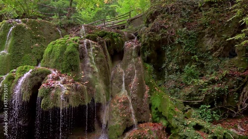 The unique beautiful Bigar waterfall full of green moss, Bozovici, Caras-Severin, Romania. Slow motion photo