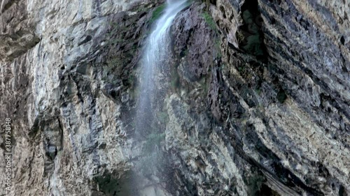 High cliff waterfall Vanturatoarea, Romania. Slow motion
 photo