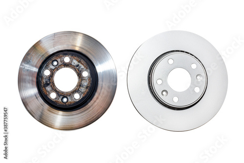 New brake disc with anti-corrosion treatment and old brake disc, isolated on a white background with a clipping path.