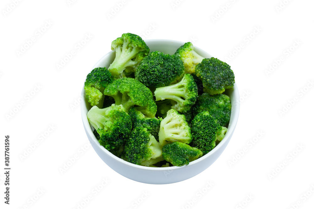 Frozen broccoli florets in a bowl isolated on white background, top view Frozen broccoli florets in a bowl isolated on white background, top view
