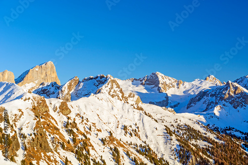 Dolomites mountain range in winter at dusk, Italy photo