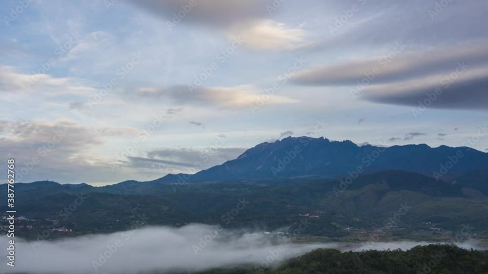 Time lapse sunrise MOUNT KINABALU, moving clouds over a villages. Taken at RANAU, SABAH, BORNEO. time lapse motion zoom in Time lapse sunrise MOUNT KINABALU, moving clouds over a villages. Taken at RANAU, SABAH, BORNEO. time lapse motion zoom in