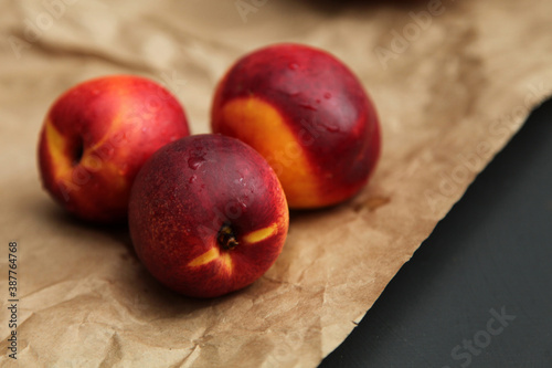 peach nectarine on wooden background