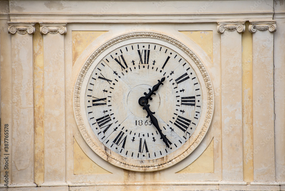Antique wall clock with roman numerals