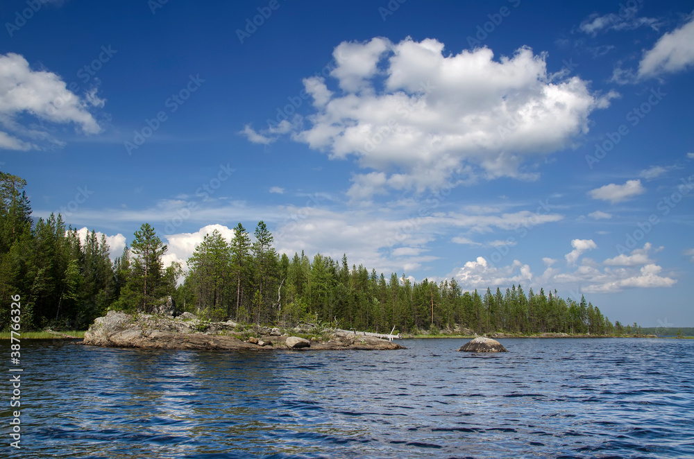 View from water on the Upper Pulongskoye Lake in Karelia (Russia) View from water on the Upper Pulongskoye Lake in Karelia (Russia)