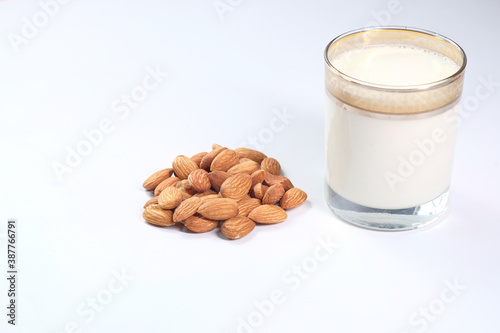  almond nut and milk white background with copy space 