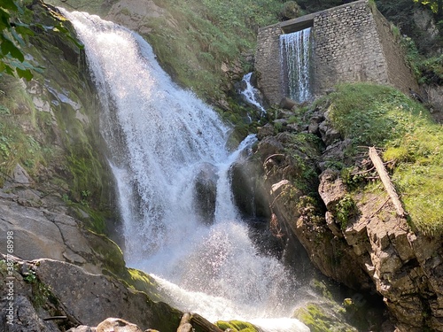 Giessbach Falls in the eponymous nature park and over Lake Brienz / Giessbachfälle (Giessbachfaelle) im gleichnamigen Naturpark und über dem Brienzersee - Canton of Bern, Switzerland (Schweiz) photo