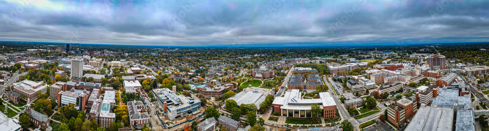 Aerial panorama of downtown Lexington, Kentucky with tall office buildings visible in a distance in the right side of the image