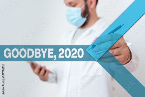 Text sign showing Goodbye 2020. Business photo showcasing New Year Eve Milestone Last Month Celebration Transition Laboratory Technician Featuring Empty Sticker Paper Accessories Smartphone photo