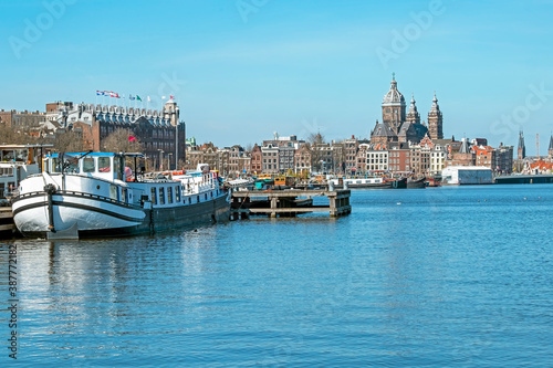 City scenic from the harbor of Amsterdam with the St. Niklaas church