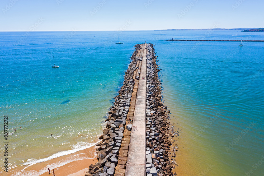 Top shot from breakwater at the entrance of Portimao harbor in the Netherlands Top shot from breakwater at the entrance of Portimao harbor in the Netherlands
