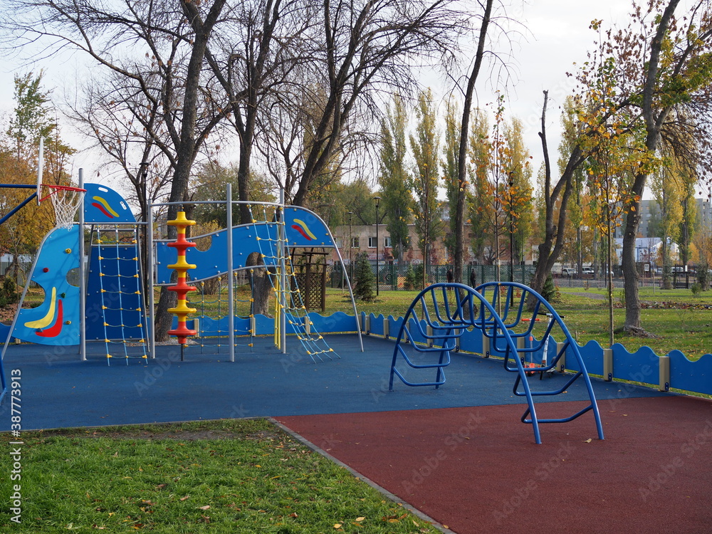 Children outdoor playground in a new residential area. Nobody. Comfortable safe urban environment. City living. Stay at home concept. Be safe. Gym Climbing Equipment. Childhood Children outdoor playground in a new residential area. Nobody. Comfortable safe urban environment. City living. Stay at home concept. Be safe. Gym Climbing Equipment. Childhood