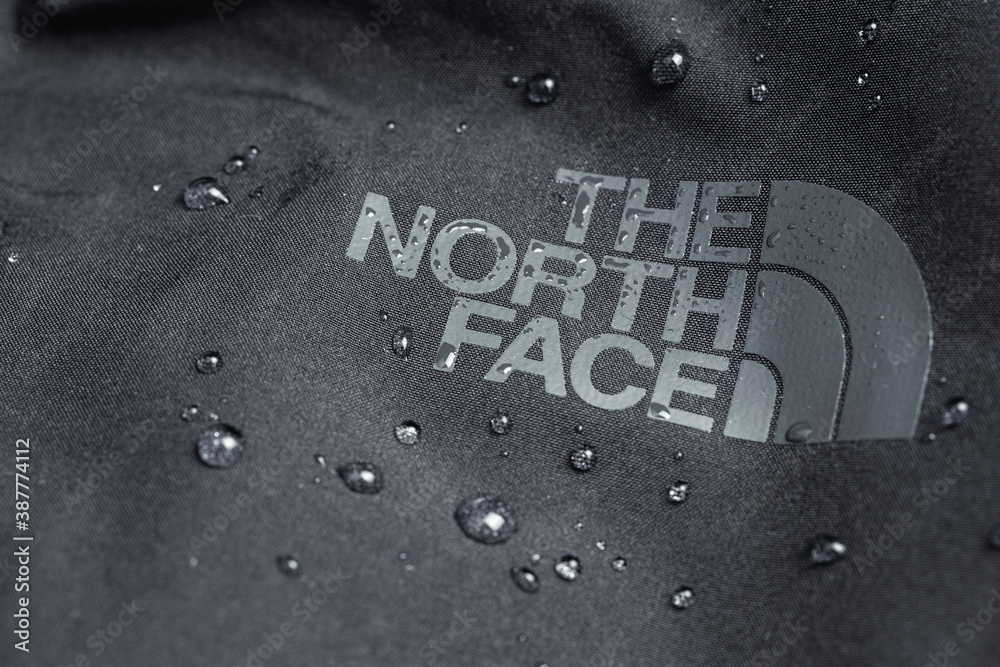 The North Face logo on black jacket with water drops. The North Face is an  American outdoor product company specializing in outerwear. Moscow, Russia  - July 18, 2020 Stock Photo | Adobe Stock