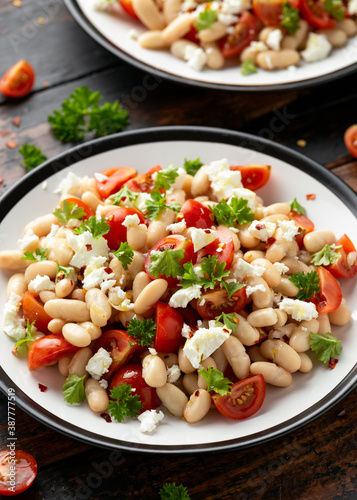 White Bean Salad with Cherry Tomatoes, Feta cheese and parsley. Healthy vegetarian, vegan food