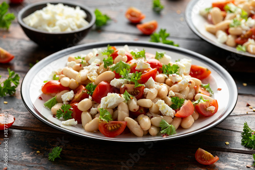 White Bean Salad with Cherry Tomatoes  Feta cheese and parsley. Healthy vegetarian  vegan food