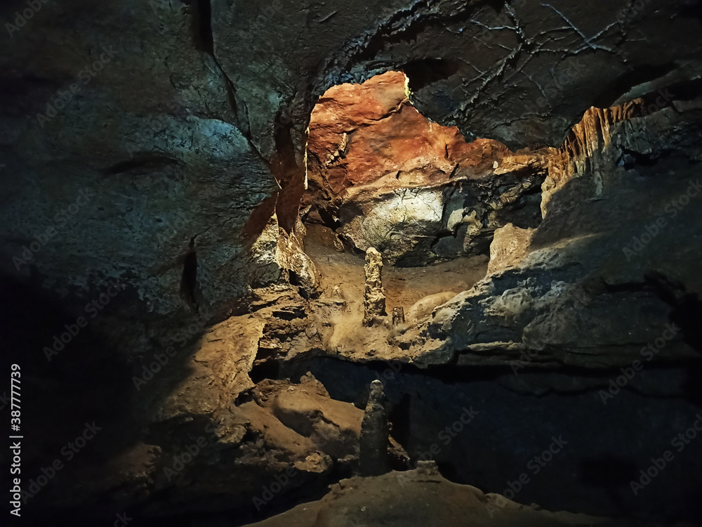 Journey. View inside a deep cave to the south. stalactites and stalagmites.