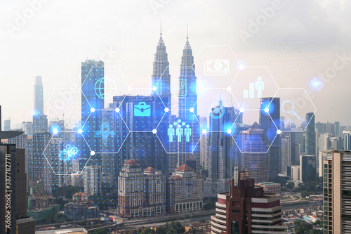 Research and development hologram over panorama city view of Kuala Lumpur. KL is hub of new technologies to optimize business in Malaysia, Asia. Concept of exceeding opportunities. Double exposure.