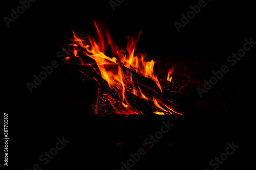 orange-red flames on a black background.fire in the night