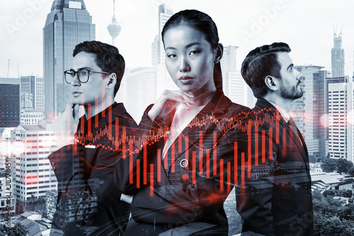 Group of business colleagues in suits as a part of multinational corporate team working on forecasting trading corporate strategy at fund. Forex chart. Kuala Lumpur on background. Double exposure © VideoFlow