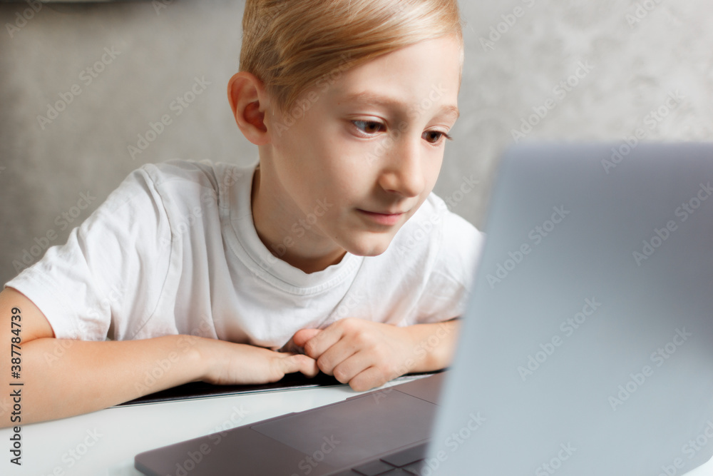 student at laptop doing homework online in quarantine student at laptop doing homework online in quarantine