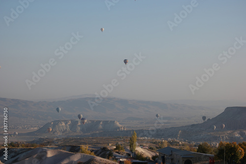 Mountains landscape with hot air balloons. Rural Cappadocia mountains landscape.