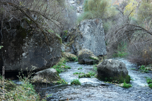 Beautiful nature view in Ihlara valley. River flowing among huge stones. Cappadocia, Turkey. photo