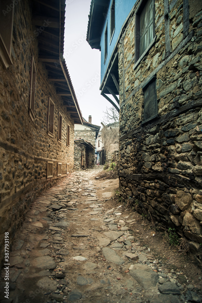Vertical shot of street of ancient village Cumalikizik in Bursa, Turkey.  Old stone village houses. Ancient Stony Street
