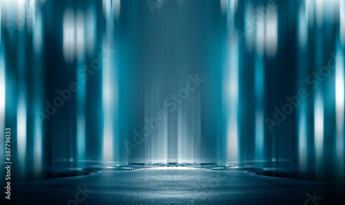 Light effect, blurred background. Wet asphalt, night view of the city, neon reflections on the concrete floor. Night empty stage, studio. Dark abstract background, dark empty street. Night city.