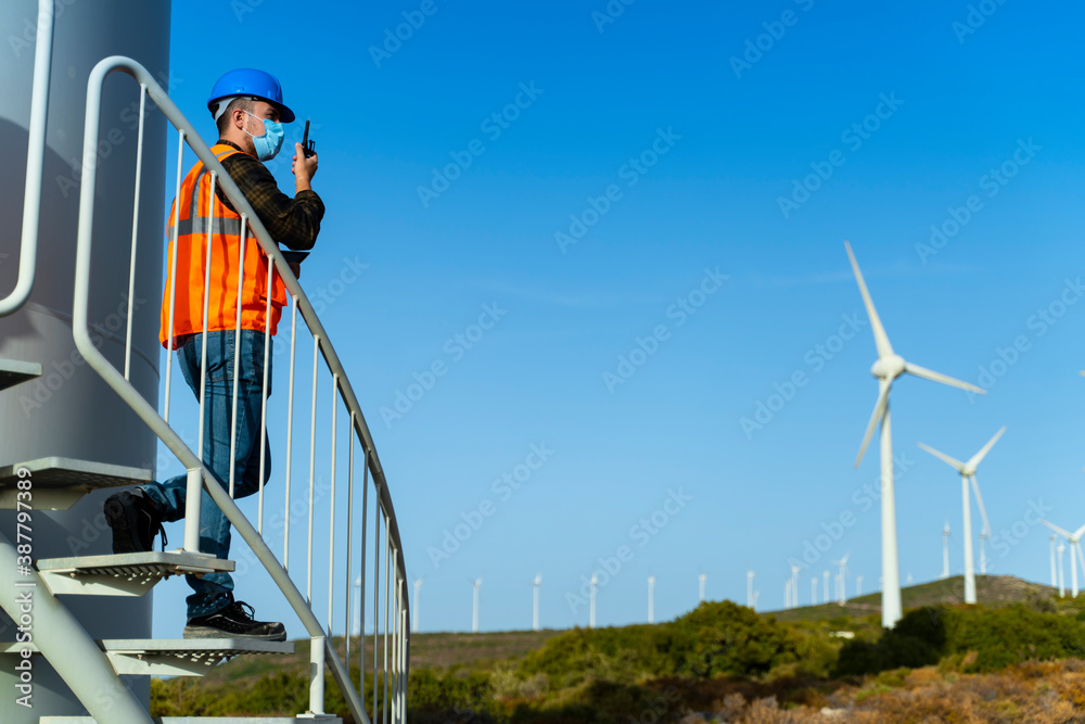 Engineering young man is checking wind turbine Renewable energy Engineering young man is checking wind turbine Renewable energy