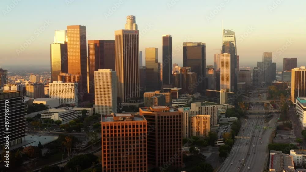 Flying towards the tall buildings of downtown Los Angeles at dawn Flying towards the tall buildings of downtown Los Angeles at dawn