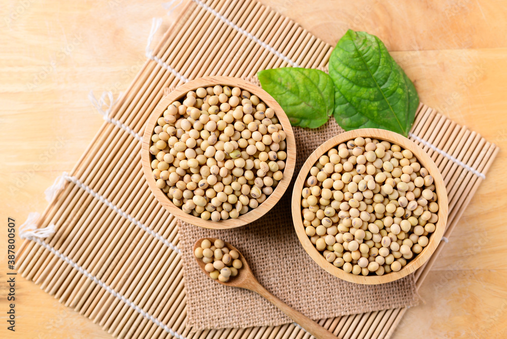 Soy beans in a bowl on wooden background Soy beans in a bowl on wooden background