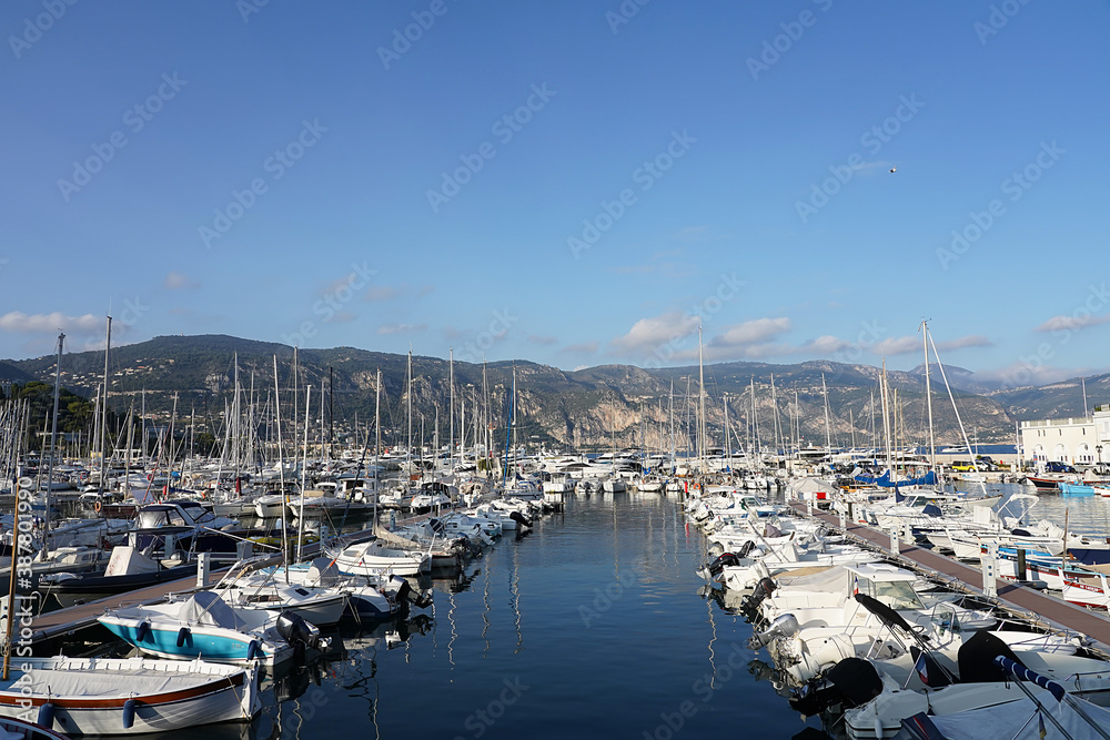 View of the bay, mountains and boats in Saint-Jean-Cap-Ferrat, France.