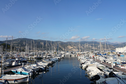 View of the bay, mountains and boats in Saint-Jean-Cap-Ferrat, France. © Evelina