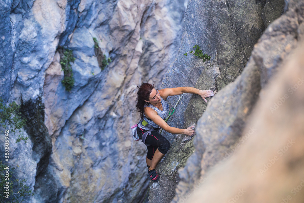 Obraz premium A woman is climbing in Turkey, Turkish woman climbs the rock.