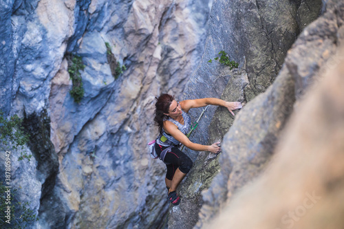 A woman is climbing in Turkey, Turkish woman climbs the rock.