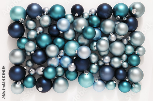 Christmas decorations, top view of pile of glass balls colored in blue, isolated on white, useful as a greeting gift card background 