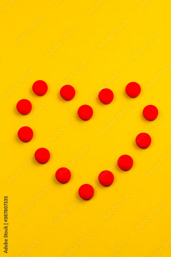 Red pills and yellow backround Red pills and yellow backround
