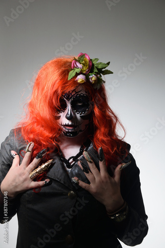 Zombie girl. Stodio portrait of female model with Halloween makeup. Halloween conception photo