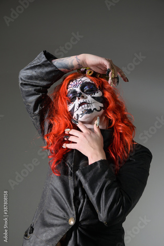 Zombie girl. Stodio portrait of female model with Halloween makeup. Halloween conception photo