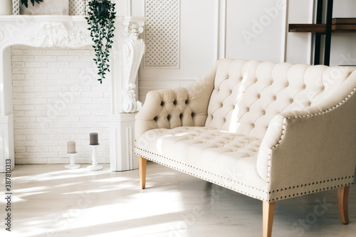 White comfortable sofa in elegant living room.