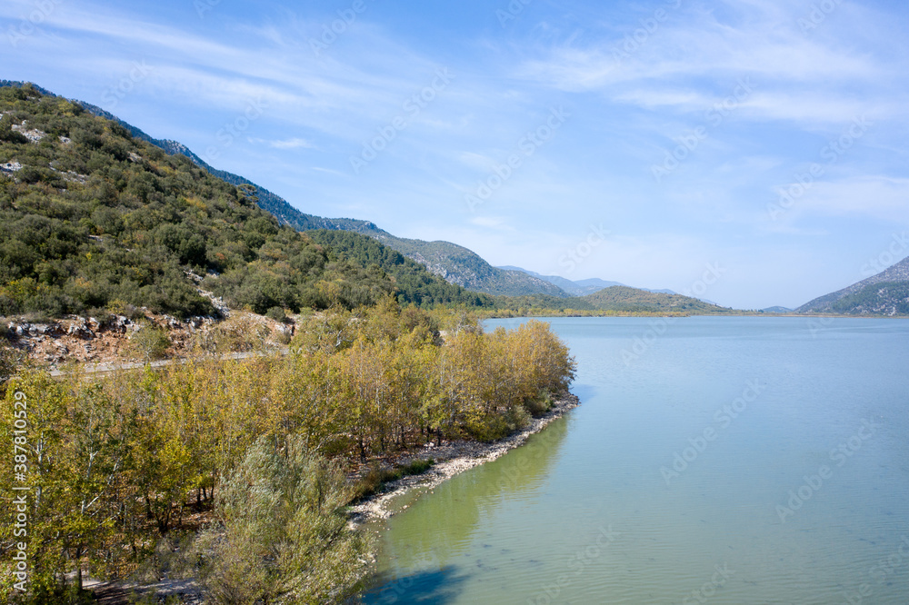 The beautiful landscapes of Kovada Lake, mountains and green area from the air. Isparta Lake District, TURKEY The beautiful landscapes of Kovada Lake, mountains and green area from the air. Isparta Lake District, TURKEY
