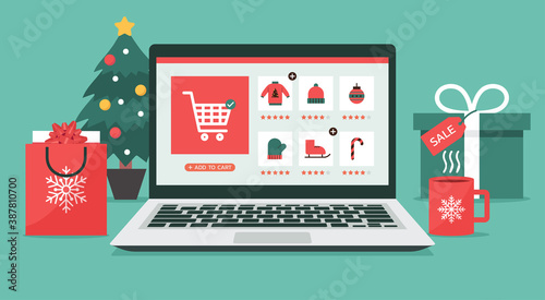 Christmas online shopping concept on laptop screen with gift boxes, shopping bags, and Christmas tree on desk, winter holidays sales, vector flat illustration