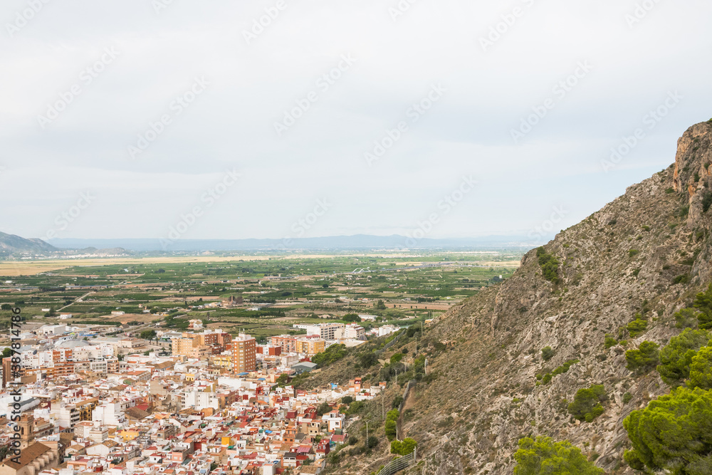 Cullera city from an aerial view. Beautiful panorama of the city and the mountains in the background. Photography taken from the historic Castle.