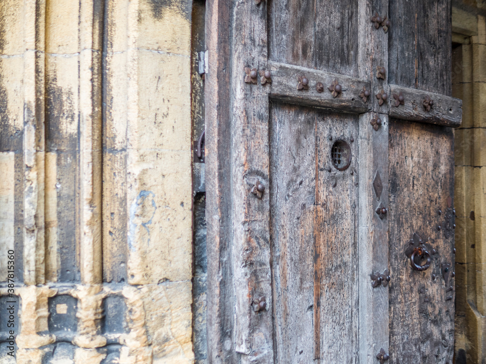 Detail of an old wooden door in Neuchatel in Switzerland Detail of an old wooden door in Neuchatel in Switzerland