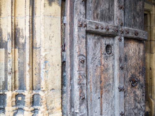 Detail of an old wooden door in Neuchatel in Switzerland © gdefilip