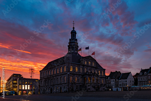 Maastricht, Netherlands 10-20-2020 sunrise above the city centre of Maastricht with the town hall and market square. The sky was full drama and of amazing and spectacular colors 