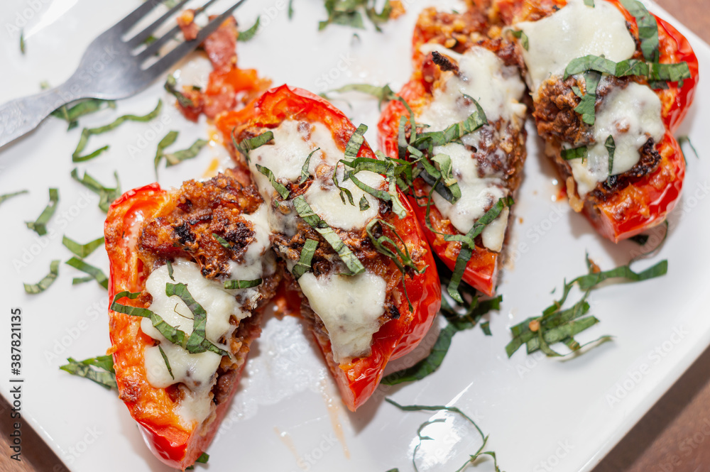 Stuffed Red Bell Peppers topped with cheese