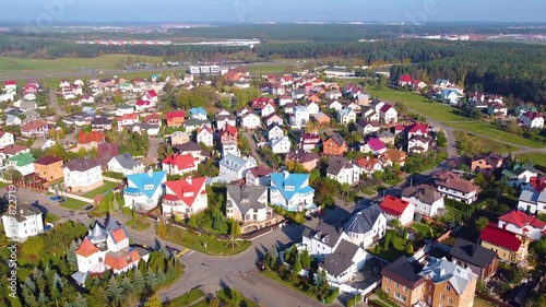 Smooth climb over beautiful suburban homes near the park photo