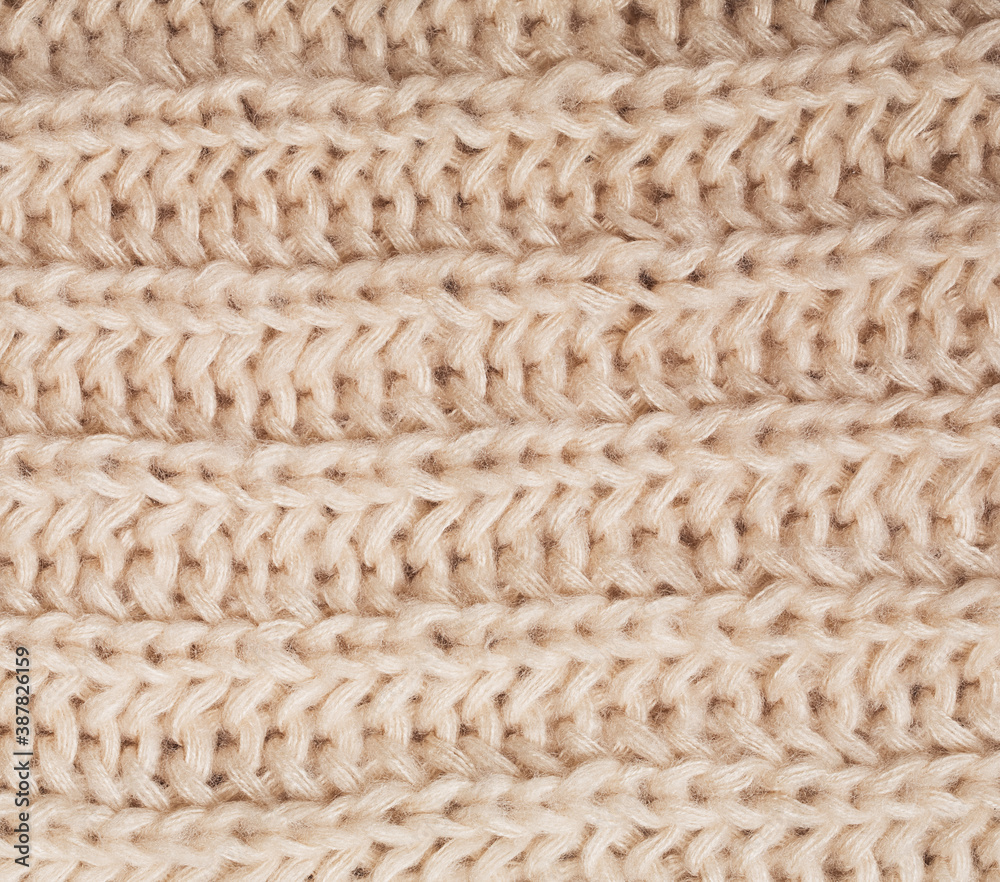 close up texture of woolen cream scarf