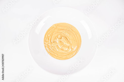 Pumpkin soup on a plate on a white background